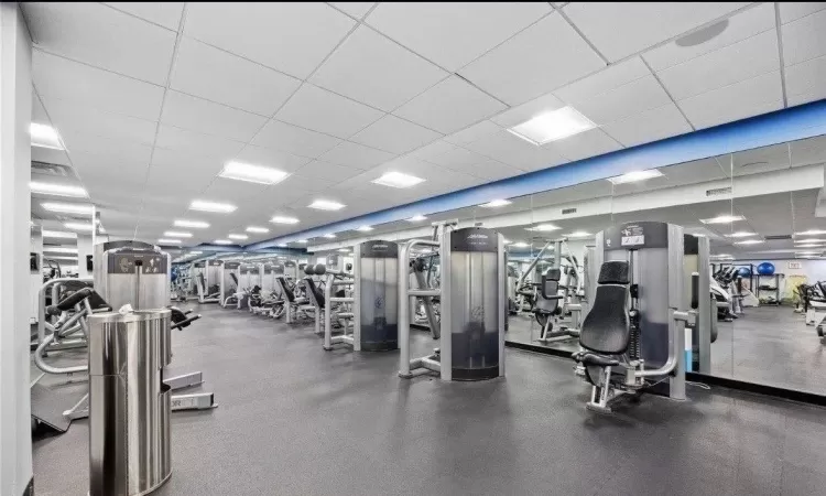 Workout area featuring a paneled ceiling