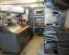 Kitchen hood, grill, fryer and ben mari station...