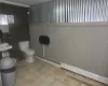 Bathroom featuring tile patterned flooring and toilet