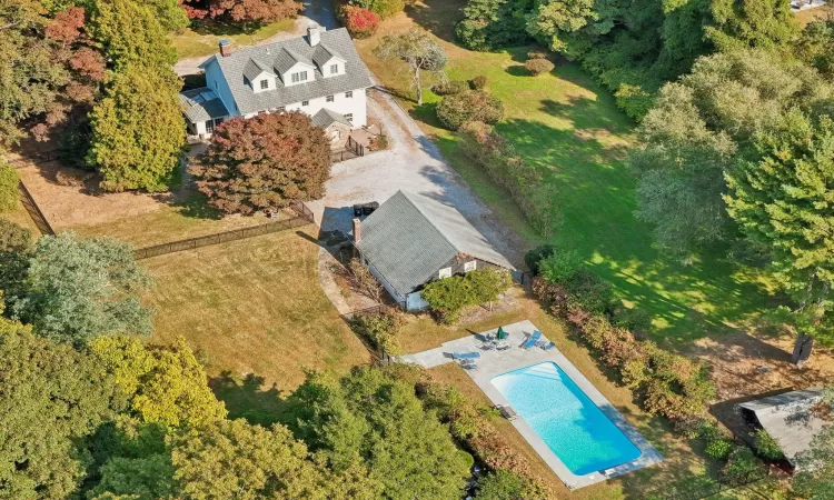 View of pool with a lawn, a diving board, and a patio area