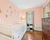 Full bathroom featuring shower / tub combo with curtain, tile walls, tile patterned flooring, radiator heating unit, and toilet