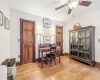 Bedroom featuring an AC wall unit and dark wood-type flooring