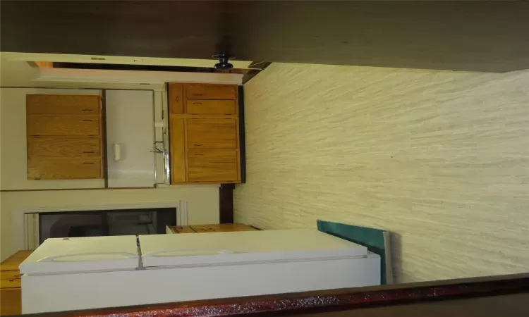 Kitchen featuring light hardwood / wood-style floors, fridge, and sink