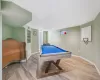 Playroom with pool table and light hardwood / wood-style flooring