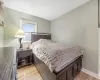 Bedroom with light hardwood / wood-style flooring