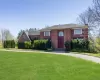 View of front of house with a yard