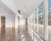 Unfurnished sunroom featuring vaulted ceiling