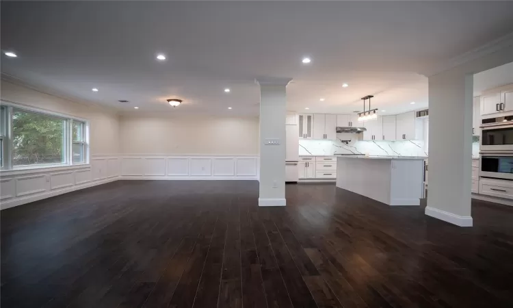 Dining room with crown molding and dark hardwood / wood-style flooring