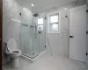 Bathroom featuring toilet, vanity, and ornamental molding