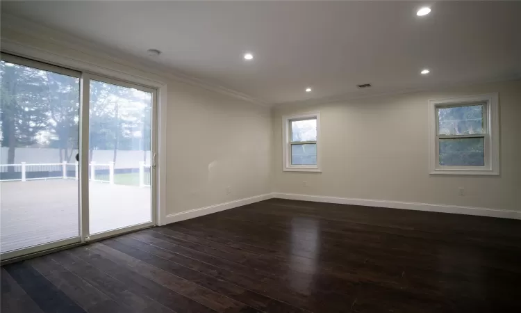 Corridor with dark hardwood / wood-style flooring