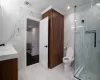 Bathroom featuring an enclosed shower and crown molding