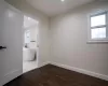 Bedroom with dark wood-type flooring