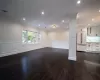 Laundry area with washer hookup, electric dryer hookup, and dark hardwood / wood-style flooring