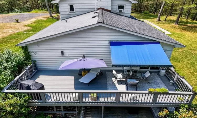 Rear view of house featuring a deck