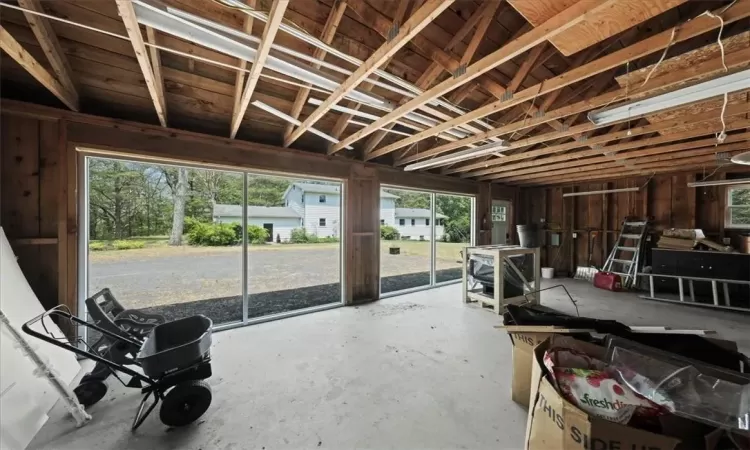 Miscellaneous room with plenty of natural light and concrete flooring