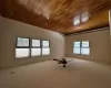 Spare room with hardwood / wood-style floors, ceiling fan, and a baseboard heating unit