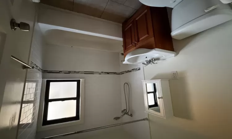 Full bathroom with tile patterned flooring, vanity, toilet, and tiled shower / bath