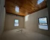 Spare room featuring ceiling fan, hardwood / wood-style floors, and a baseboard heating unit