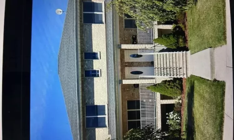 View of front of house featuring a front yard and a porch