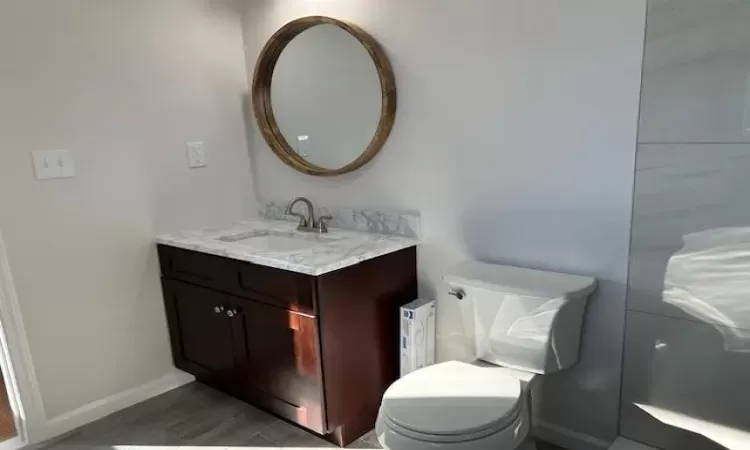 Bathroom with vanity and toilet