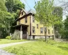 View of front of home featuring a porch and a front lawn