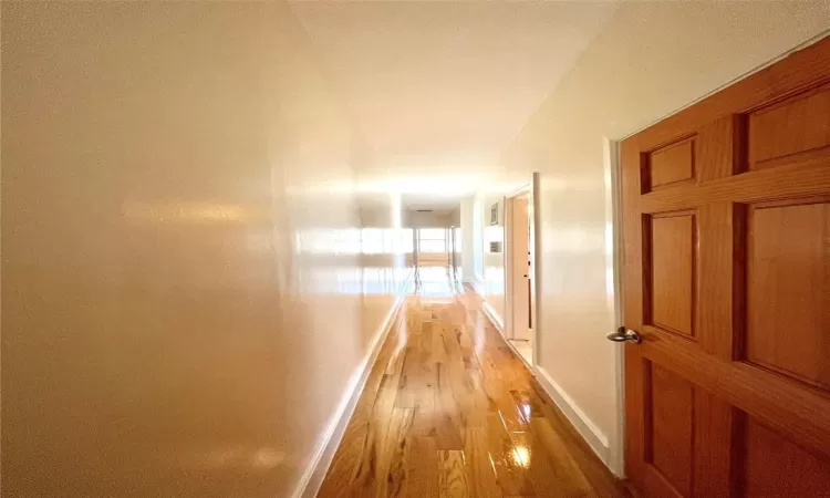 Hall featuring light hardwood / wood-style flooring