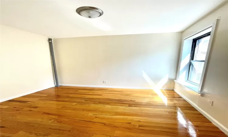 Unfurnished room featuring wood-type flooring