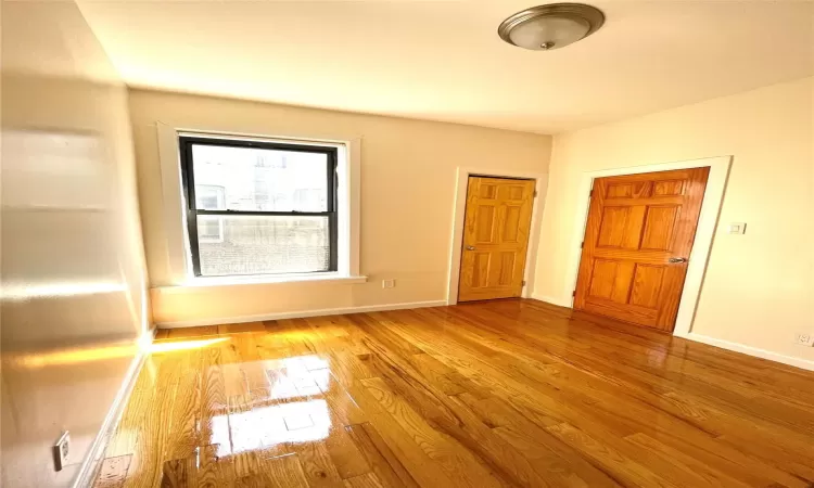 Unfurnished room featuring light wood-type flooring