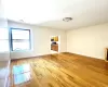 Empty room with light hardwood / wood-style floors