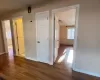 Hall featuring an AC wall unit and dark hardwood / wood-style floors