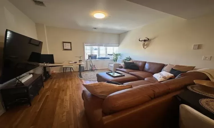 Living room featuring hardwood / wood-style floors