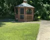 View of outbuilding featuring a yard