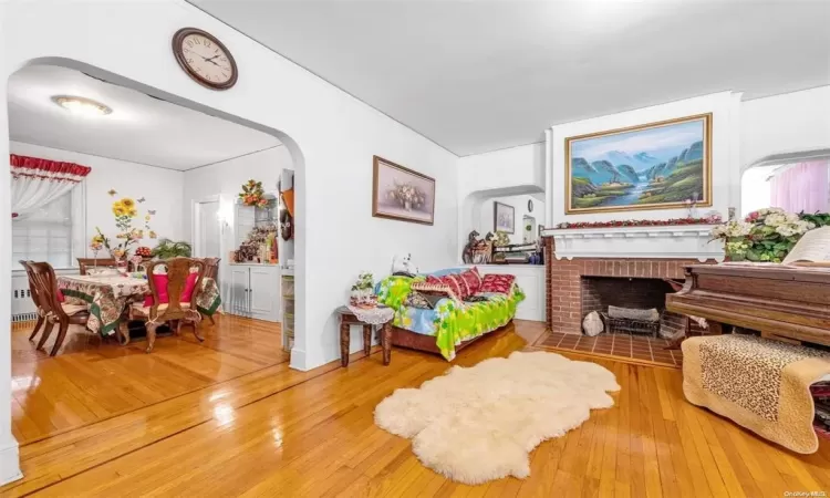 Sitting room featuring hardwood / wood-style floors and a fireplace