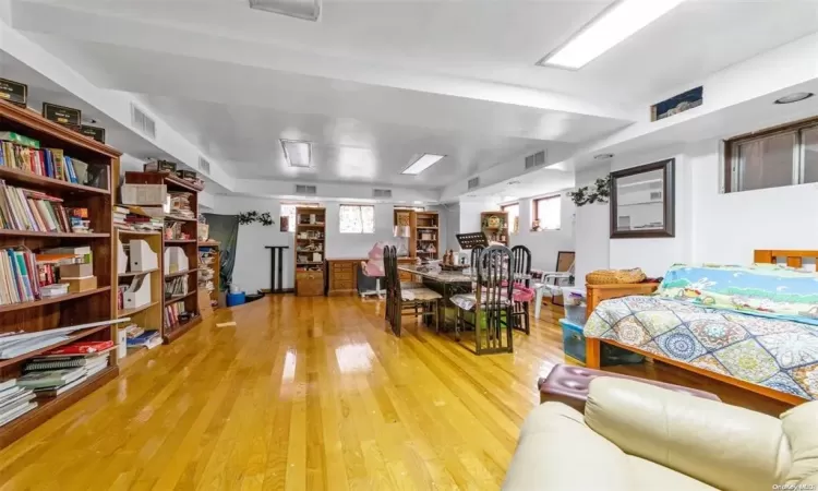 Bedroom with hardwood / wood-style floors