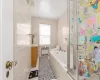 Full bathroom featuring vanity, plus walk in shower, tile patterned floors, toilet, and radiator heating unit