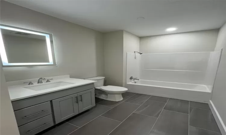 Full bathroom with vanity, toilet, and shower / bath combination