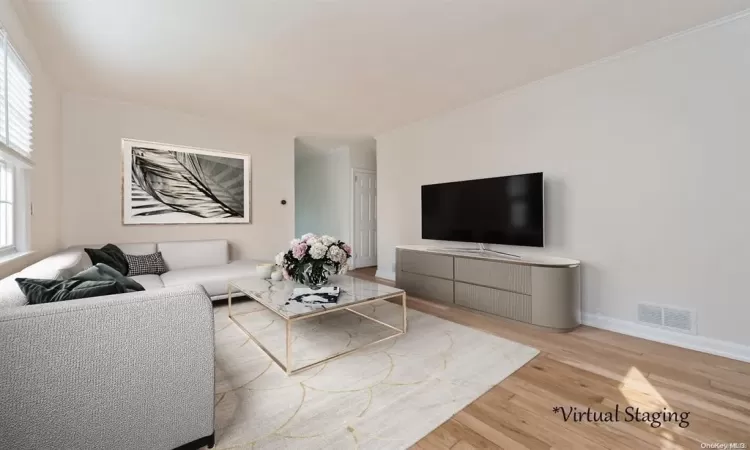 Living room with light wood-type flooring