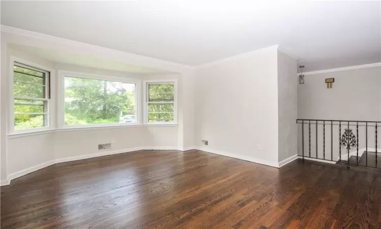 Dining room with hardwood floors, Venetian plaster walls, set back far from Soundview