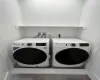 Laundry room featuring washing machine and clothes dryer