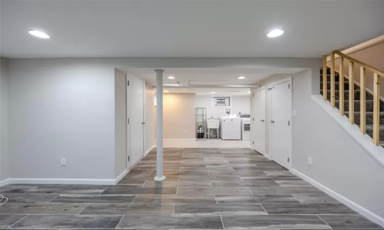 Hallway featuring washer and dryer