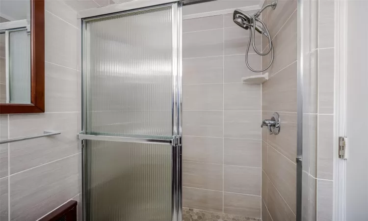 Bathroom with a shower with shower door