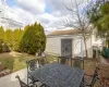 View of patio featuring a shed