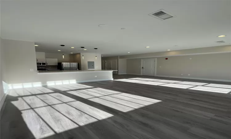 Unfurnished living room featuring hardwood / wood-style floors