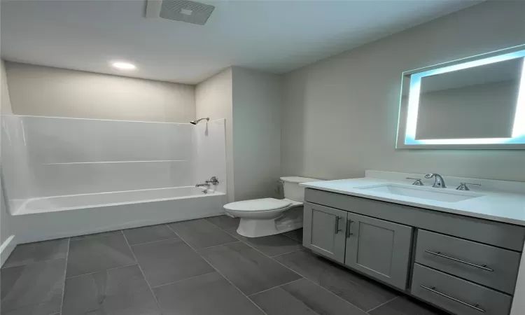 Full bathroom with shower / washtub combination, vanity, and toilet