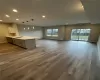 Kitchen with stainless steel dishwasher, plenty of natural light, sink, and hanging light fixtures