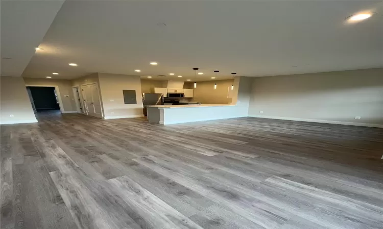 Unfurnished living room with light hardwood / wood-style floors