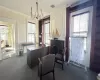 Office featuring carpet floors, crown molding, and a chandelier