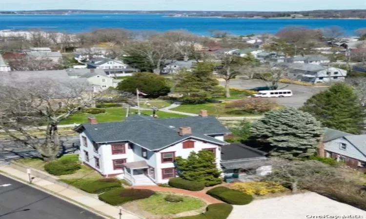 Aerial view featuring a water view