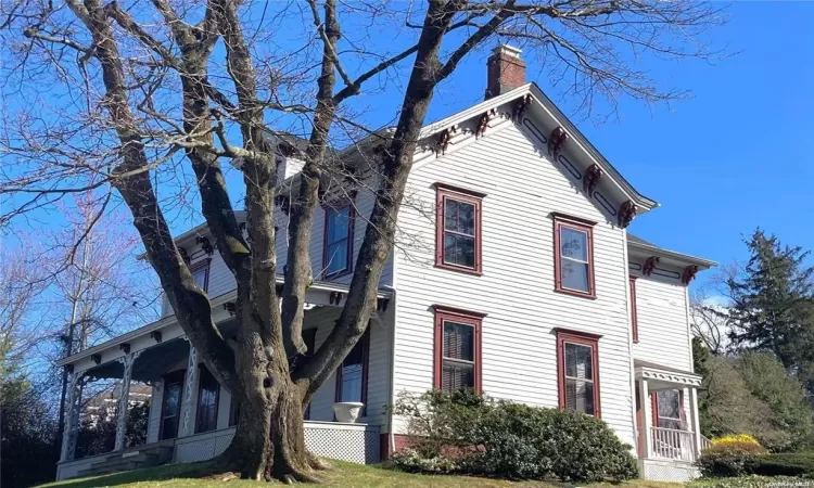 View of front of property with a front lawn