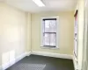 Unfurnished room featuring carpet